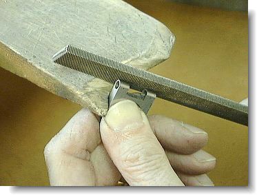 Filing the top of the blank