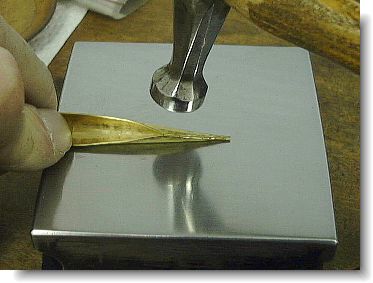 Hammering the tubing blank