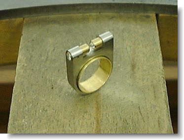 Blank, bezel and tubes with diamonds, before assembly