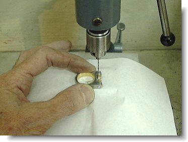 Drilling the rivet holes through the gold tubes