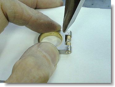 Riveting the gold tubes to the ring